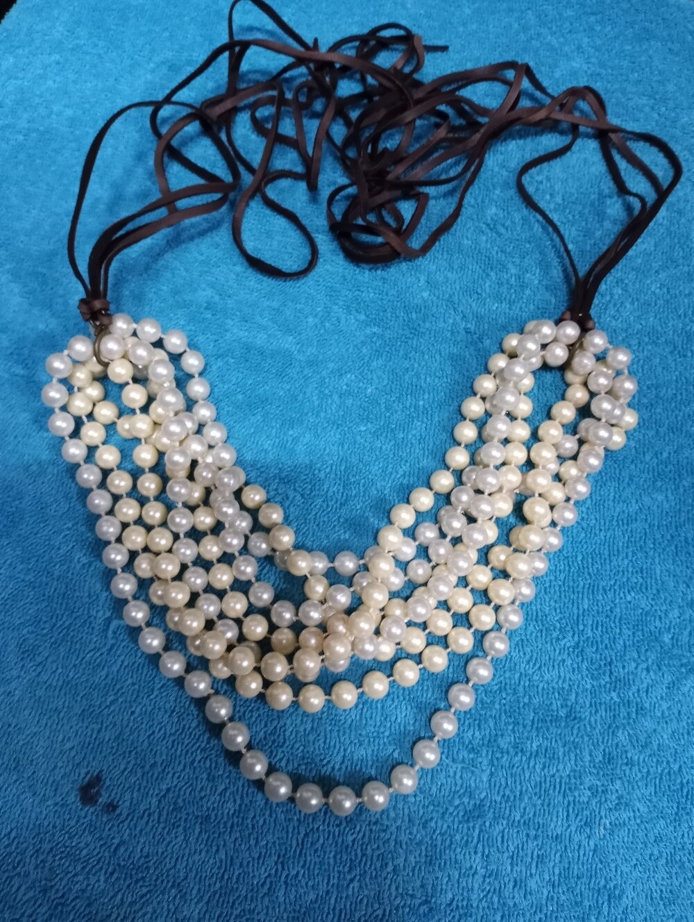 Multi-Strand White Pearl Necklace with Brown Leather Ties